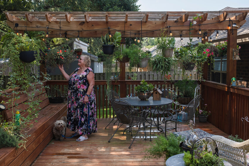 Embracing an outdoor lifestyle, Clark decided to transform her porch into her personal retreat. &ldquo;I wanted a deck because our deck slopes downward and I was not as stable as I was now, so I was afraid of falling,&rdquo; she said. Clark envisioned a pergola that would allow her to hang baskets. &ldquo;The deck is 24 feet long and then I had the guy put three end tables, two on the end and one in the middle,&rdquo; said the master gardener. She had her deck designed so that none of the plants blow over during windy weather