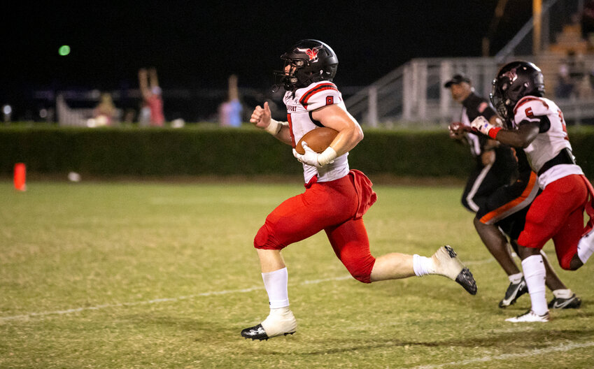 Spanish Fort&rsquo;s Drew Williamson hits the open field on his 56-yard touchdown run that put the Toros ahead of the Baldwin County Tigers 14-13 in the third quarter of Friday&rsquo;s Class 6A Region 1 game at Lyle Underwood Stadium in Bay Minette. It was just the second play after Williamson took over at quarterback.