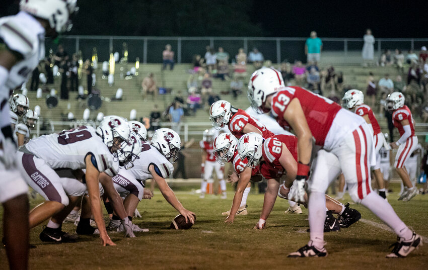 The St. Michael Cardinals line up for action against the Satsuma Gators on W.C. Majors Field at Fairhope Municipal Stadium on Sept. 21 within Class 4A Region 1. St. Michael prevailed in a 55-54 contest in overtime against the T.R. Miller Tigers on Friday to set a single-game scoring record and earn a sixth win of the season to tie another school record.