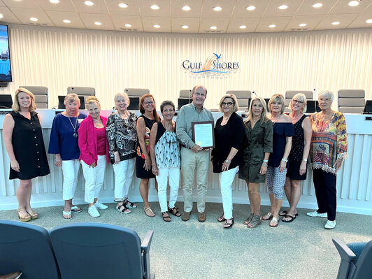 Mayor Robert Craft, pictured holding the proclamation with Club President Joanne Randolph at the Sept. 25 city council meeting.