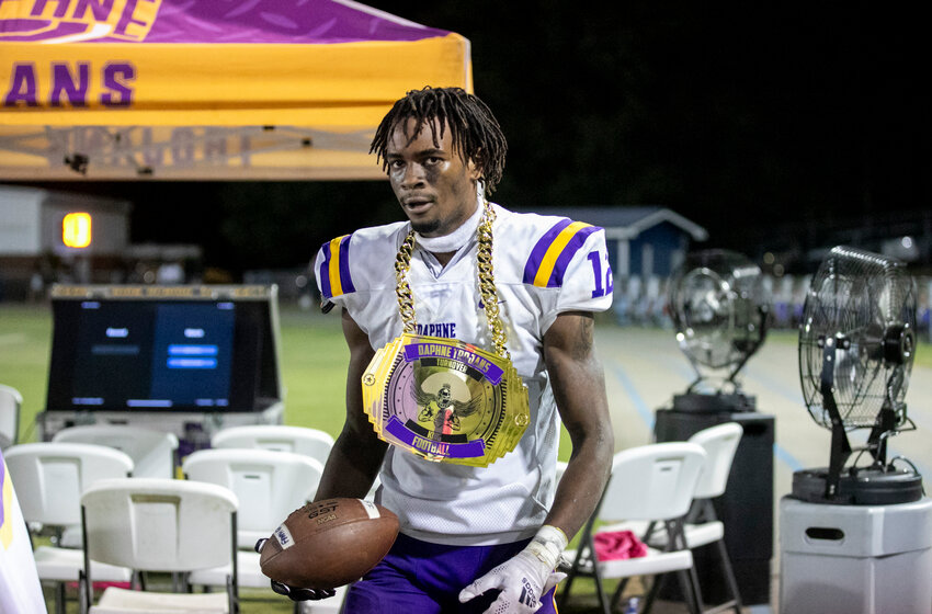 Daphne senior Al Woodard celebrates his game-sealing interception in the final minute of the Trojans&rsquo; 16-13 win over the Fairhope Pirates on W.C. Majors Field Friday night. Daphne&rsquo;s victory marked the first in the rivalry since 2020.