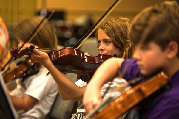 A young violinist practices during Baldwin County Youth Orchestra&rsquo;s summer strings camp in Fairhope on June 28. Students from 8-17 participate in the all-skills camp.