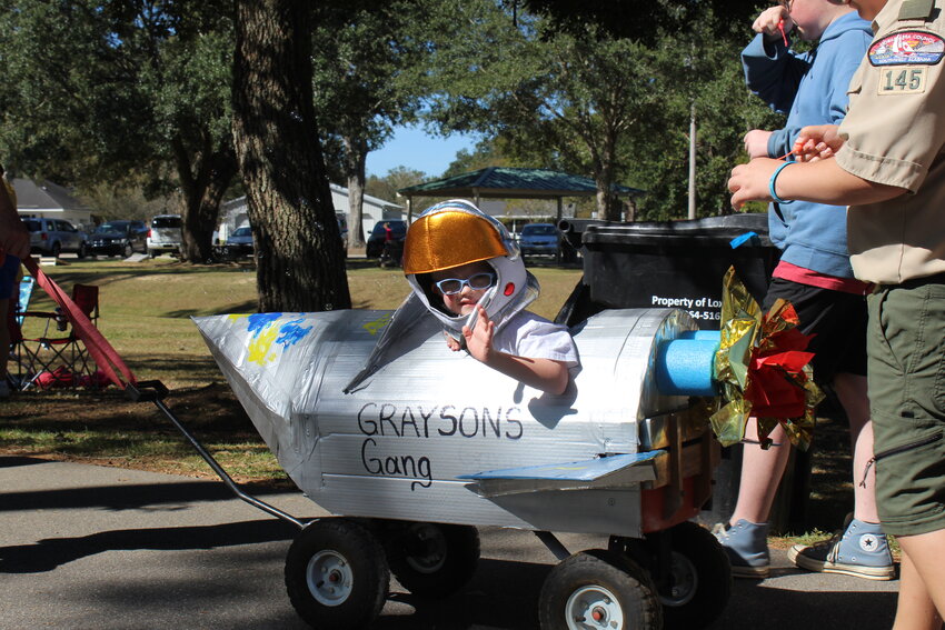 Grayson had the top ride for the 2023 Buddy Walk. His handcrafted rocket ship led his team.