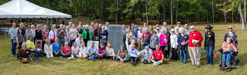Members of the Baldwin County Historical Society gathering by the new monument which recognizes the 100 years of the society on Oct. 22 at Blakely State Park.
