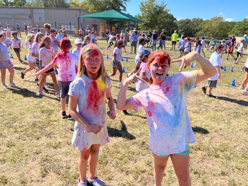 Students at Fairhope West Elementary School looked like a rainbow haze on Friday, Oct. 20, as the school hosted a color run and booster fundraiser.