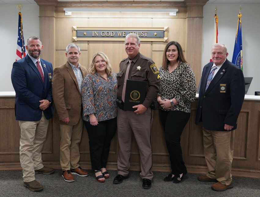 Cpl. John Garner alongside the Baldwin County Commissioners as he receives a resolution in his honor at the BCC regular session on Oct. 17.
