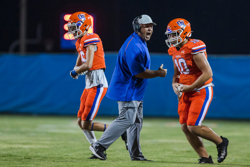 Orange Beach head coach Jamey DuBose celebrates a Mako touchdown during their homecoming contest against the Satsuma Gators on Sept. 15 at the Orange Beach Sportsplex. DuBose helped lead Orange Beach&rsquo;s first home playoff game with an 8-3 overall record in 2022.