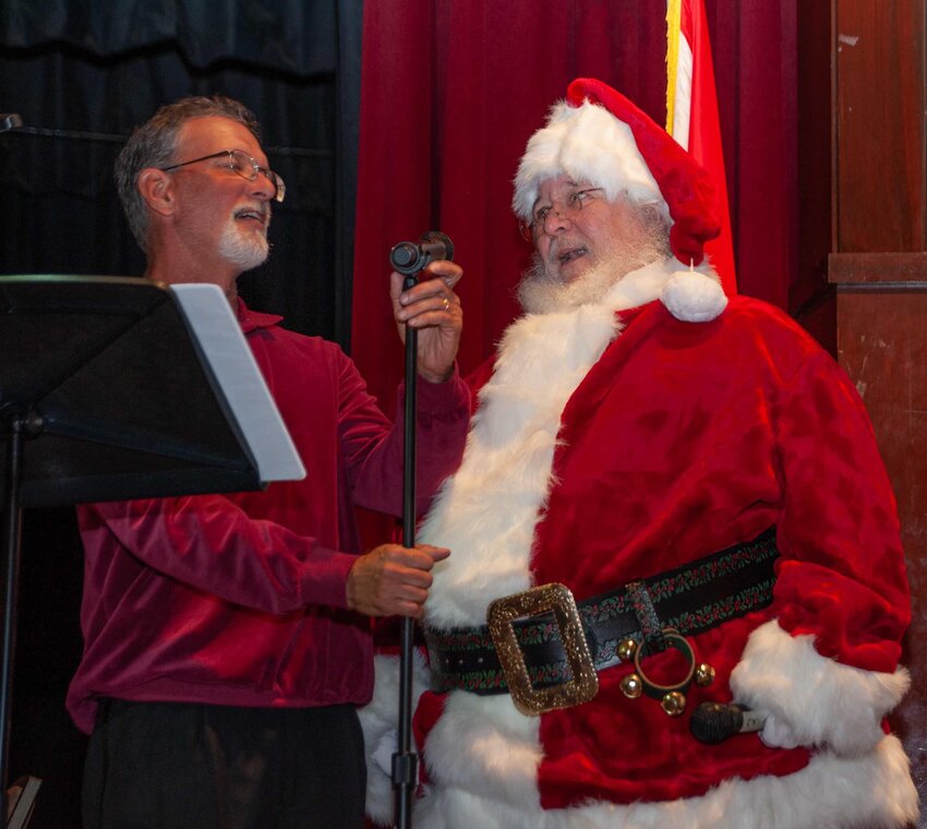 Santa sings with The Baldwin Pops band during a previous Christmastime concert. All Baldwin Pops concerts are free. They will perform this holiday show in Daphne, Foley and Gulf Shores.