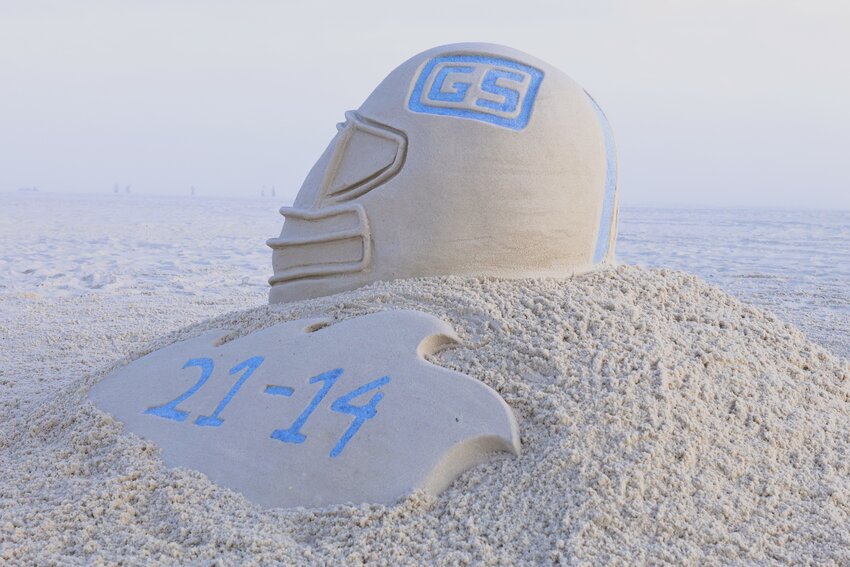 On an unusually warm and sunny Saturday in December, Janel Hawkins, owner of Sand Castle University, made an impromptu decision to sculpt a sand tribute to her hometown football team, the Gulf Shores High School Dolphins after they won their first state championship in football.