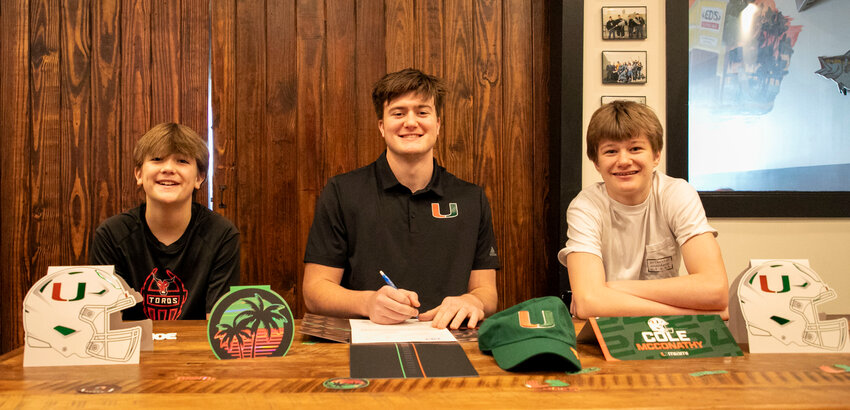 Spanish Fort senior Cole McConathy sealed his National Letter of Intent during a ceremony at Ed&rsquo;s Seafood Shed on Wednesday, Dec. 20, as the early football signing period opened. McConathy is set to take his talents to South Beach and play for the Miami Hurricanes.