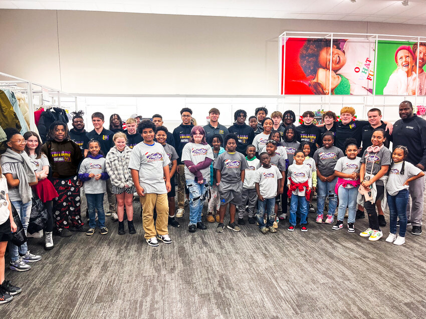 Kenny King Charities hosted its 10th-annual Christmas Shop-A-Thon at the Daphne Target on Friday, Dec. 22, where 26 elementary and middle school students received a free shopping spree with their favorite Trojan football player.