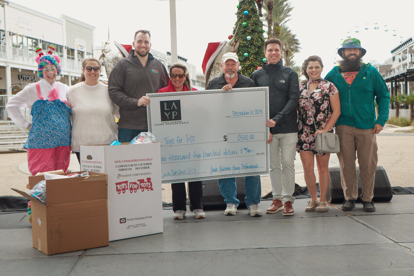 The 4th Annual Santa Pub Crawl raised a record $2,500 and two boxes of toys for South Baldwin County&rsquo;s Toys for Tots chapter. The event is hosted by the Lower Alabama Young Professionals (LAYP) and was sponsored by the Hilton Garden Inn Orange Beach.