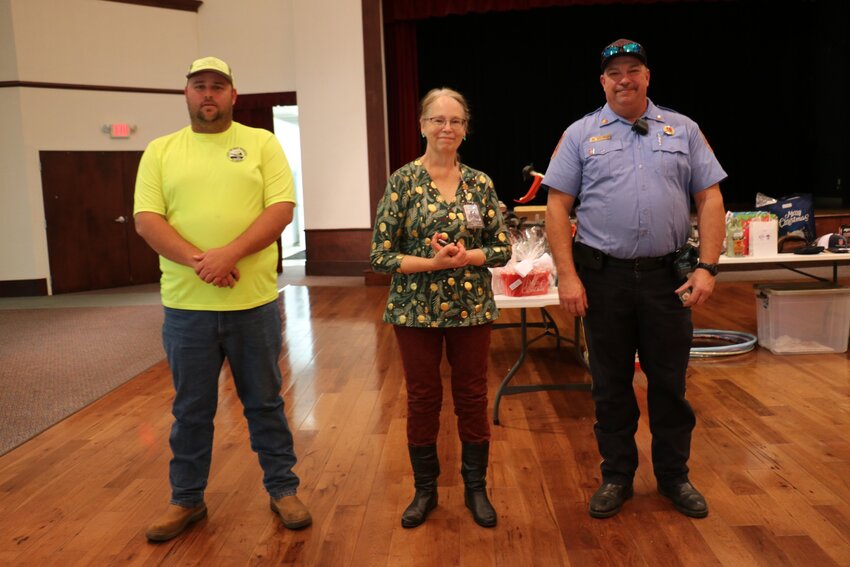 David Johnson, Public Works, Victoria Barnett, Library, and Rob Taylor, Fire Department, honored for 15 years of service.