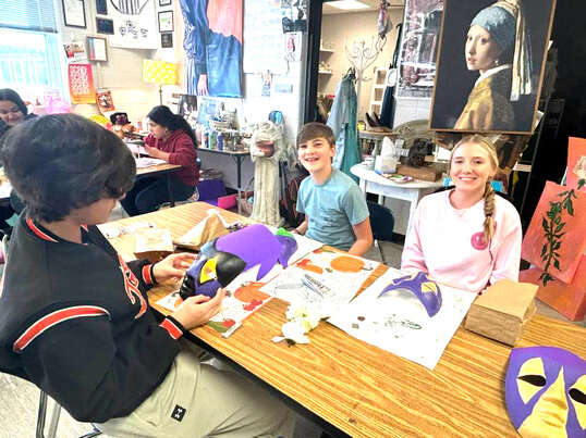 Third grade students at Florence B. Mathis Elementary School celebrate Mardi Gras history by making their own masks and floats out of shoe boxes.