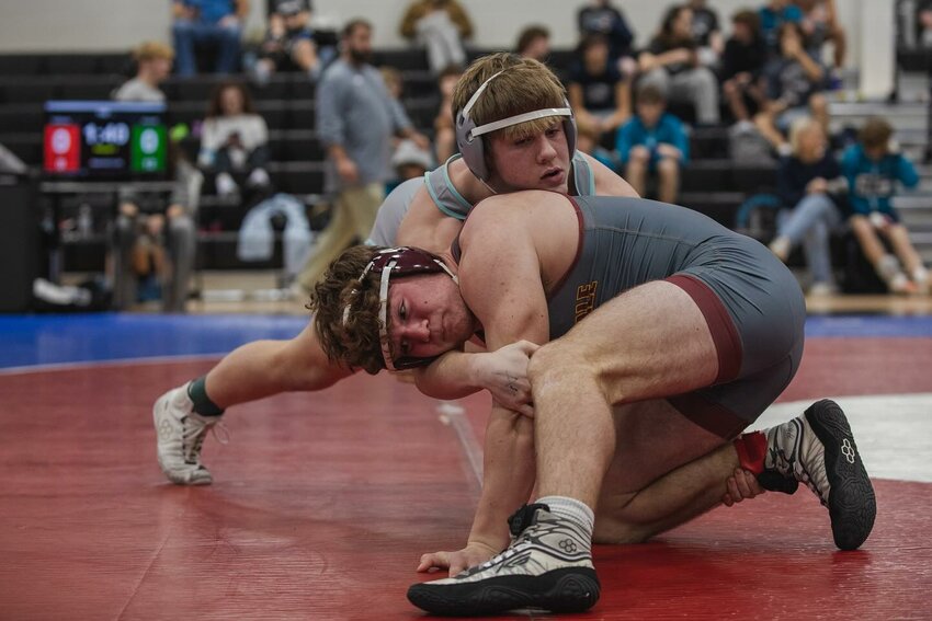 Gulf Shores sophomore Landon Everett grapples with Robertsdale freshman Hunter Williams during a quad match at Elberta High School on Jan. 23. With a second-round pin in Saturday&rsquo;s state finals at the Von Braun Center, Everett was crowned Class 5A&rsquo;s 190-pound champion.