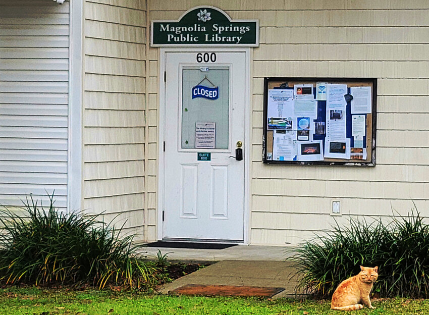 A closed sign hangs on the entrance of Magnolia Springs Public Library (MSPL) as the community faces uncertainty over its future.