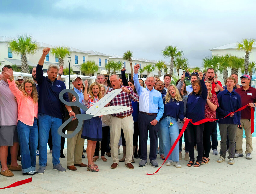 Officials from Liquid Life Vacation Rentals and Beach Village Resort, along with representatives from the Coastal Alabama Business Chamber and guests, gather for the grand-opening ribbon cutting ceremony at Beach Village Resort in Orange Beach on March 5. The event marked the official launch of the resort, showcasing its luxurious amenities and partnership with Liquid Life Vacation Rentals.