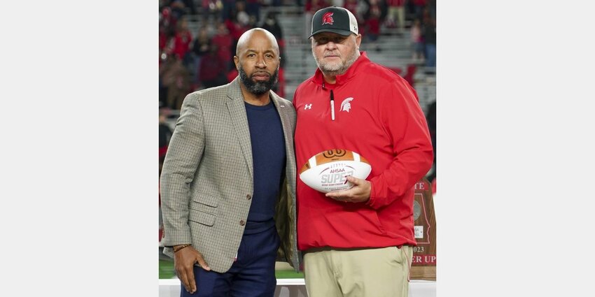Brandon Dean, Director of the Alabama High School Athletic Directors &amp; Coaches Association, congratulates Saraland head football coach Jeff Kelly at the Class 6A state football finals in Tuscaloosa on Dec. 8, 2023. Kelly was announced as the head coach of the Alabama All-Stars ahead of the 38th-annual Alabama-Mississippi Football Classic on Wednesday, March 20.