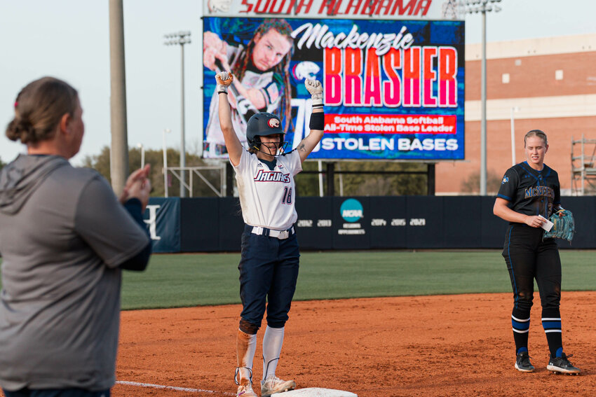 Gulf Shores alum and South Alabama graduate student Mackenzie Brasher celebrates her 76th career stolen base during the Jaguars&rsquo; matchup against the McNeese State Cowgirls on Tuesday, March 26. Brasher stole 4 bases as a freshman, 8 as a sophomore, 20 as a junior, 27 as a senior and now owns 17 thefts on the season which ranks in the top 25 of the nation.