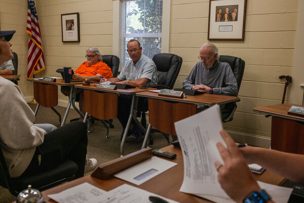 Members of the Magnolia Springs Town Council, and Mayor Ross Houser in the middle, meet on March 26, where they voted to table a decision on the Magnolia Springs Public Library. Currently, the library is temporarily closed. The decision on if the library is to remain closed is now scheduled to be decided at the April 23 town council meeting.