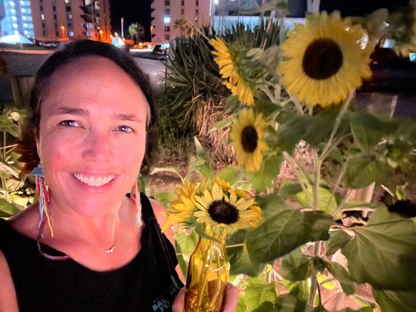 Tara McMeans, winner of the 20th Annual Gulf Coast Hot Air Balloon Festival post contest, didn't have to look far for her inspiration. Sunflowers in her yard are featured in the artwork.