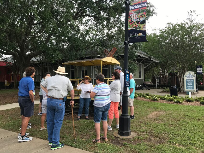 A group gathers at Foley&rsquo;s 1909 Railroad Depot for a walking tour. The 2024 tours will begin April 6 and continue each Saturday throughout the month.