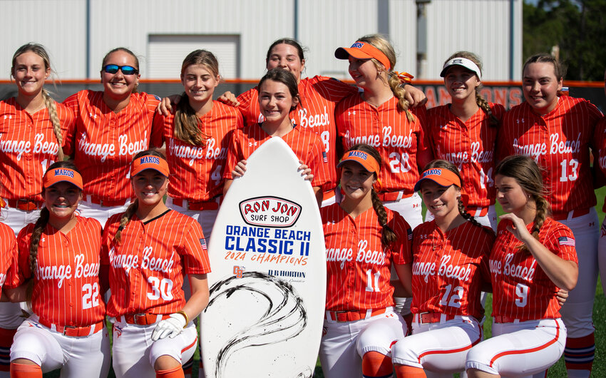 The Orange Beach Makos pose for a photo with the championship surfboard following the Orange Beach Classic 2 Tournament at home on March 23. Entering this week of play with a 19-0 record, the Makos were the top-ranked team in the new edition of the SBLive Power 25 national high school rankings.