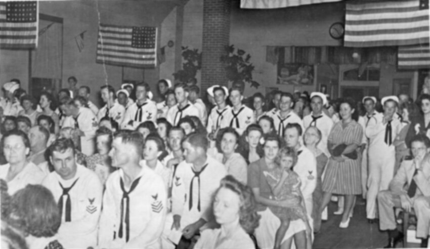 Foley residents and Barin Field Navy personnel attend an event at the community&rsquo;s USO Club on Aug. 22, 1944. The building is now the Gift Horse Restaurant.