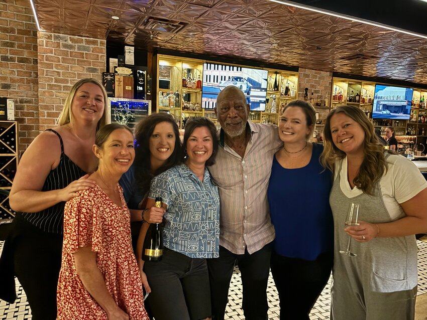 Actor Morgan Freeman takes a photo with a group of locals at 8 Reale OBAL at The Wharf in Orange Beach on Monday, April 15, 2024.