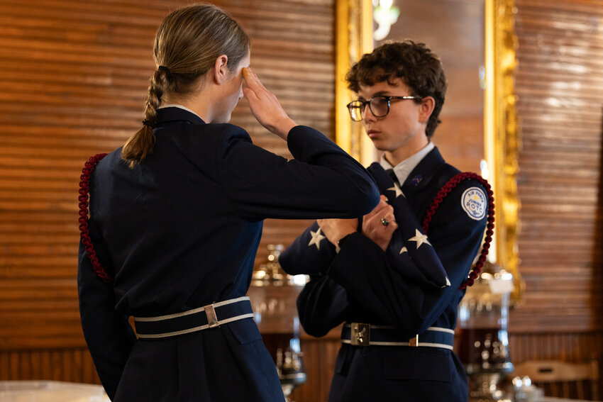 During the event, Foley High School's Junior Reserve Officers' Training Corps (JROTC) conducted a flag folding ceremony, an observance that symbolizes respect and honor for the flag. The ceremony involves two individuals facing each other, holding the flag at waist height, folding it in half lengthwise and then folding it into a triangular shape 13 times, revealing only the blue starred field.