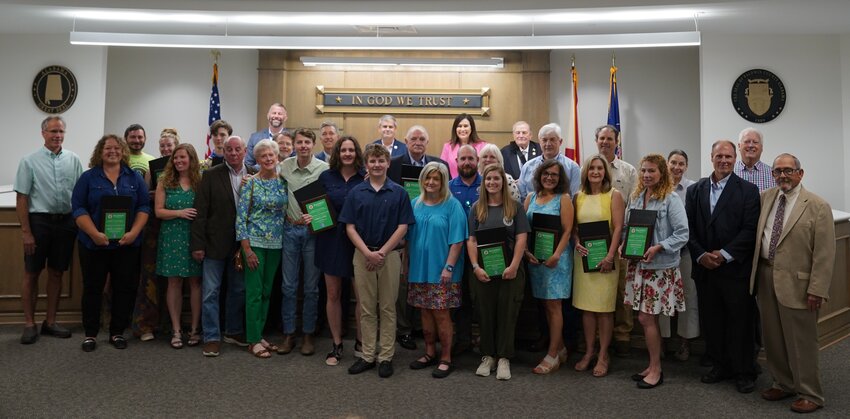 Angie Eckman, Foley's environmental manager and recipient of the 2024 Baldwin County Environmental Stewardship Award, poses with other distinguished awardees during the ceremony held by Baldwin County Commission on Tuesday, April 16.
