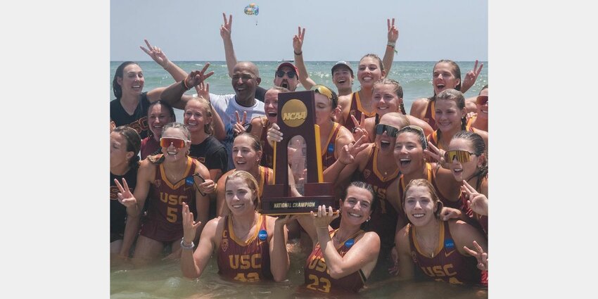 The USC Women of Troy pose with their fourth consecutive NCAA Beach Volleyball National Championship in Gulf Shores waters following a sweep of UCLA in the finals on Sunday, May 5, at Gulf Place Beach. The win made the beach volleyball team the first from USC, men’s or women’s, to claim four straight national championships since 2013.