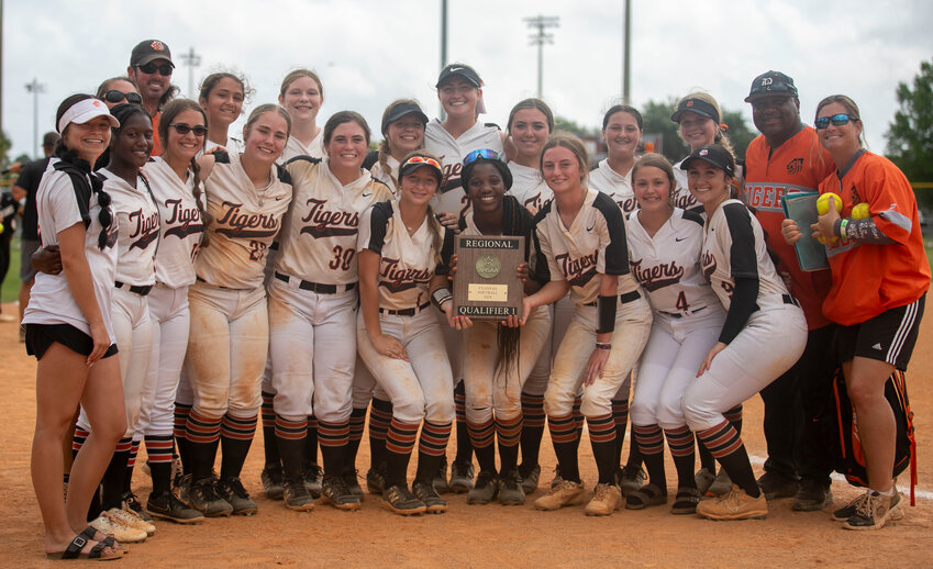 The Baldwin County Tigers pose with the top-qualifier plaque following a 1-0 win over the Saraland Spartans in the Class 6A South Regional Championship at the Gulf Shores Sportsplex Tuesday afternoon.