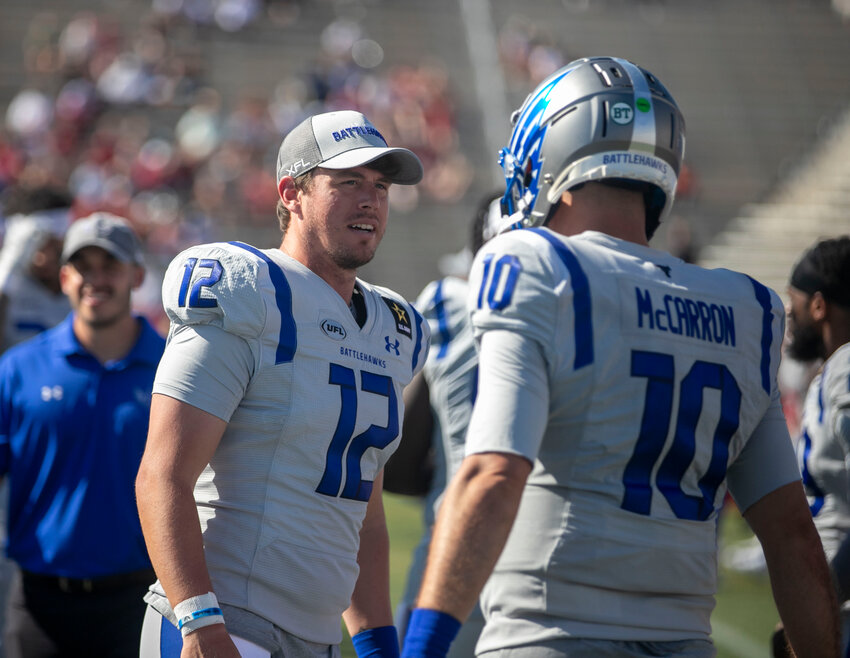 Lower Alabama natives Brandon Silvers (12) and AJ McCarron (10) converse on the sideline during the Week 7 United Football League contest between the St. Louis Battlehawks and Birmingham Stallions at Protective Stadium on Saturday, May 11. The friends and former competitors are now teammates, and roommates, in the professional spring league based out of Dallas, Texas.