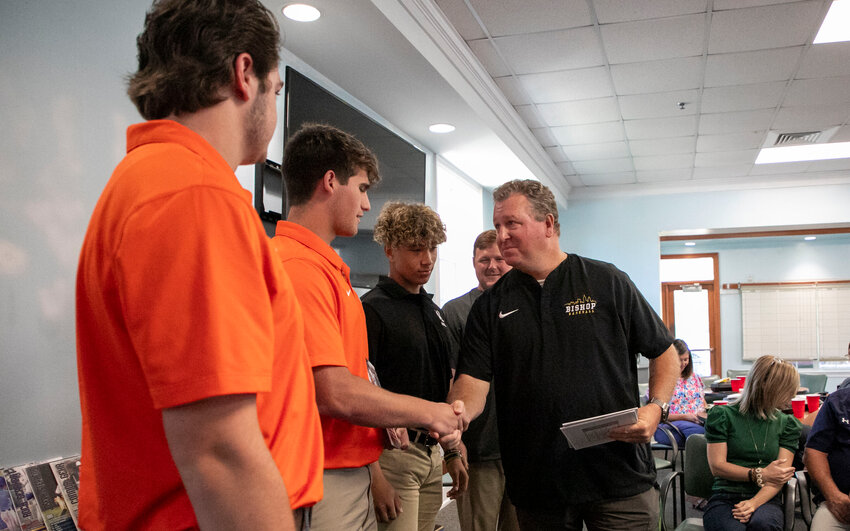 Bishop State head baseball coach James Hattenstein congratulates Baldwin County senior Jaxen Schuler for his Pitcher of the Year honor presented by the Midtown Optimist Club at the Azalea City Golf Course on Wednesday, May 22. Schuler, a Bishop State signee, was joined by teammates Quincy Walters (Player of the Year) and Eli Woody in being recognized.