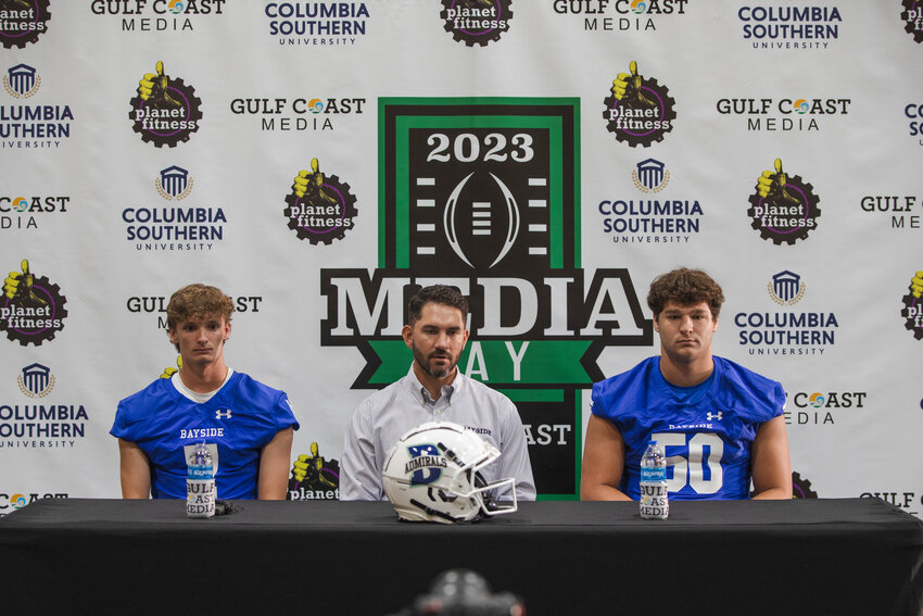 Bayside Academy, represented by head coach Barrett Trotter and seniors Tait Moore (7) and Graham Uter (50), was one of the local football teams who converged on the Orange Beach Event Center for the second-annual Gulf Coast Media Day on July 27, 2023. The third-annual event is set to return to The Wharf on Thursday, July 25, to help kick off the 2024 season.