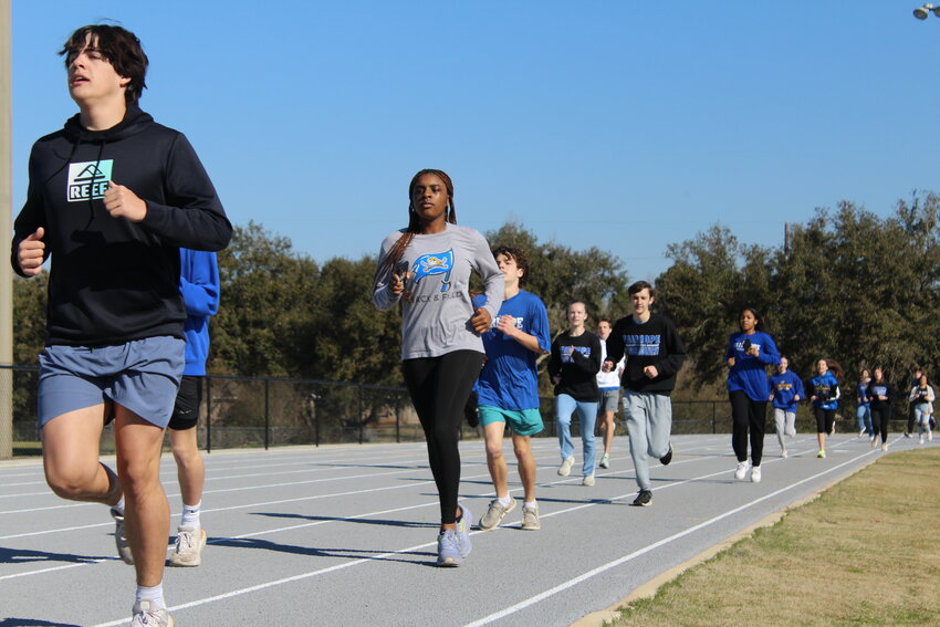 Fairhope High School track and field team members, coaches, city and school officials celebrated the completion of the Track and Field Complex at Founders Park with a ribbon cutting and first lap on the track Tuesday, Feb. 20. The $2.5 million project was a collaboration between the City of Fairhope, Fairhope Single Tax Corporation and Baldwin County Public Schools.