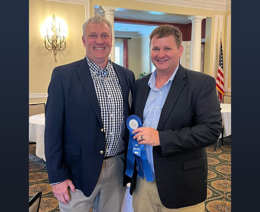 Bayside Academy Head of School Dr. Scott Phillipps (left) receives the Blue Ribbon Award from AISA Executive Director Michael McLendon.