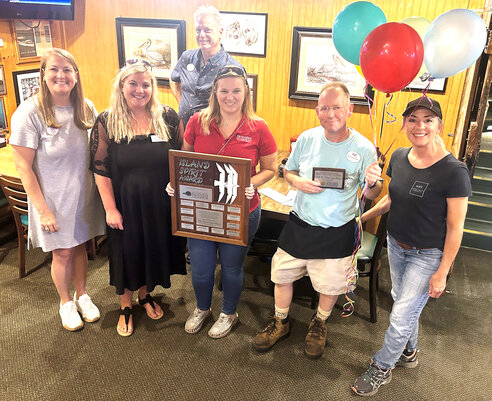 Pictured from left is the Island Spirit committee: Kimberly Ray, Samantha Fender, Steve Jones, Marie Parrish and Stephen and Molly Cooley. Each month, committee members review nominations and select winners.