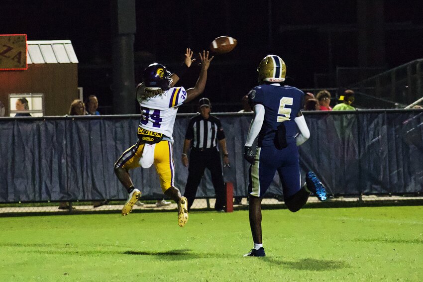 Daphne freshman Labrayln Coleman hauls in one of sophomore Jaylyn Thibodeaux&rsquo;s two first-half touchdown passes in the Trojans&rsquo; Class 7A Region 1 game against the Foley Lions on the road at Ivan Jones Stadium on Friday, Sept. 13. The Trojans went on to secure a 36-14 victory to move to 3-1 overall.