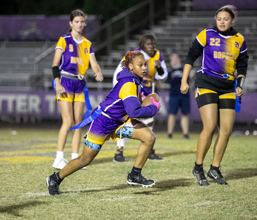 Daphne&rsquo;s Abby J. Johnson hits the open field during the Trojans&rsquo; Class 6A-7A Region 1-2 Tournament contest against the Alma-Bryant Hurricanes at Jubilee Stadium on Oct. 30, 2023. Johnson recently set an AHSAA single-game record with five interceptions in Daphne&rsquo;s 32-12 win over B.C. Rain on Sept. 19 to complement a pair of receiving touchdowns.