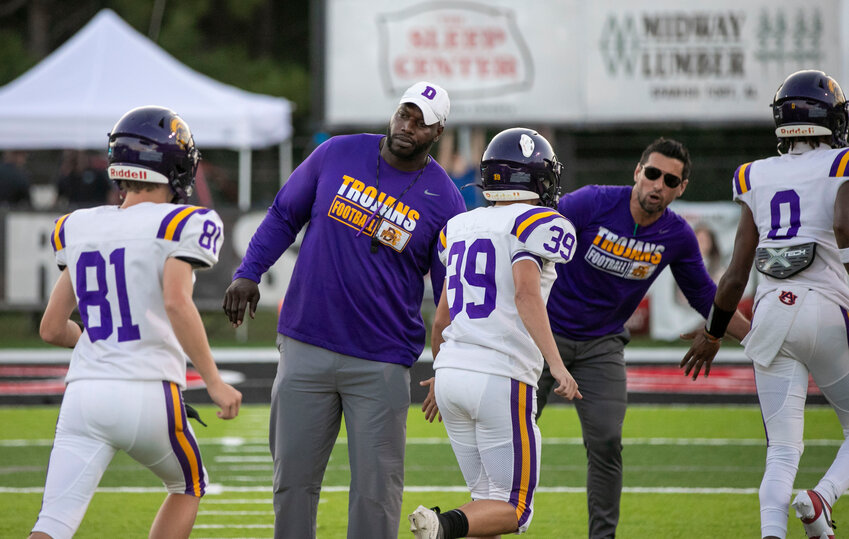 Daphne head coach Kenny King greets his team as they return to the locker room ahead of an away non-region kickoff against the Spanish Fort Toros on Sept. 27. King was recently named the head coach of the South All-Star squad ahead of the 66th AHSAA North-South Football Classic set for Dec. 13 at Mobile’s Hancock Whitney Stadium.