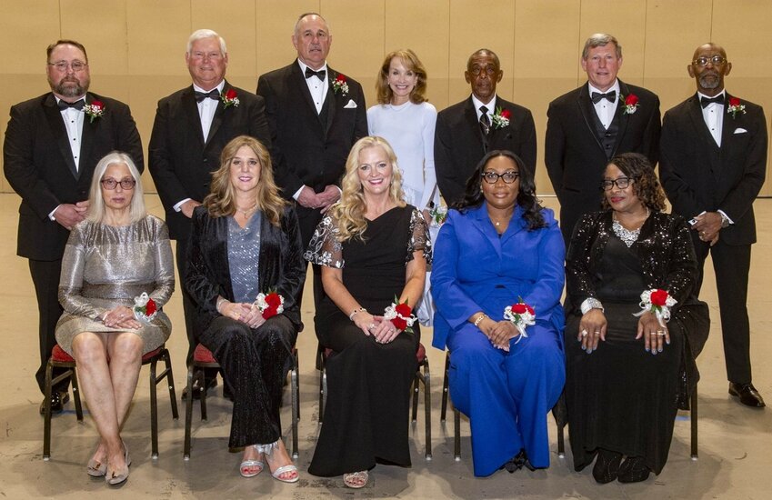 The 12 newest members of the Alabama High School Sports Hall of Fame were officially enshrined during a Monday ceremony in Montgomery. Pictured from the left in the front row are Diane Ferguson (representing her late husband Drew Ferguson), Melanie Donahoo, Tanya Broadway, Ashley Bell (representing her late father Emanuel Bell) and Dr. Benitha Mathews (representing her late husband Floyd Mathews). In the back row are Brent Hubbert, Steve Bailey, Robert Burdette, Meridy Jones, Ranard Davis, Matt Cimo and Merrill Provience (representing his late father Hadley Provience).