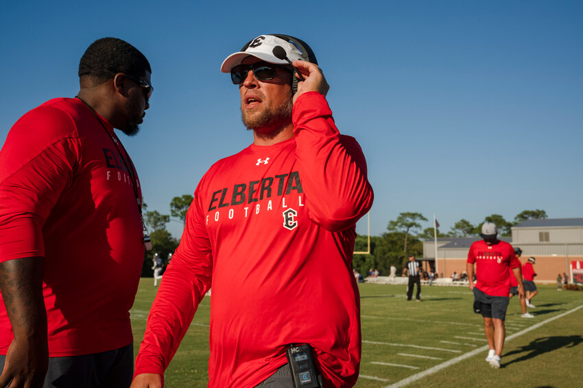The last thing the Elberta Warriors see when they leave the locker room at John T. Cobb Stadium is a sign that says “48 for 48” in honor of their late teammate Avery Pickle who passed away last summer leading up to his senior season. Head football coach Nathan McDaniel is pictured tapping the sign before the season-opener against Orange Beach on Aug. 23, 2024.