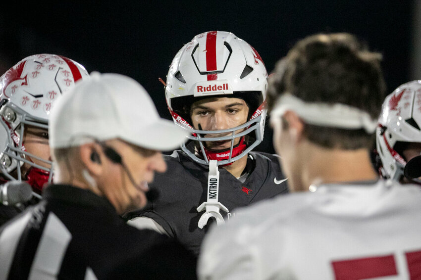 Cooper Kurth and the St. Michael captains meet with Handley Tiger representatives at midfield before the Cardinals’ first-ever home playoff game on Nov. 7, 2024, in Fairhope. In his final season as a St. Michael Cardinal, Kurth helped the team register its best regular-season record at 9-1 to earn the first-round playoff game at the new on-campus stadium.