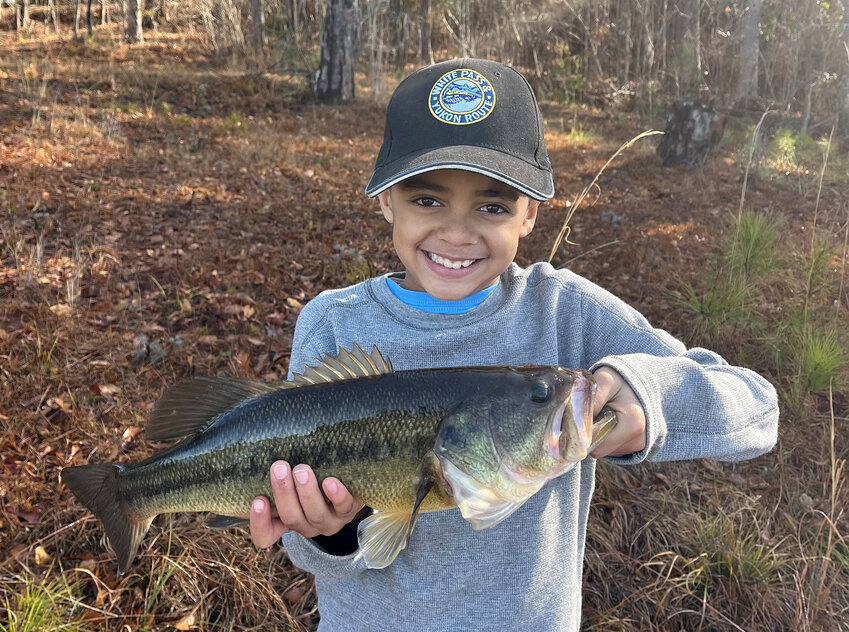 Kessler Brown shows off the nice largemouth bass he caught at Crenshaw County Lake.