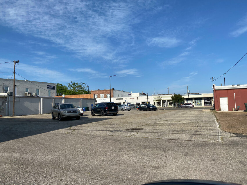 Foley will buy the parking lot near the corner of South McKenzie Street and West Laurel Avenue. The city currently leases spaces at the site for public parking.