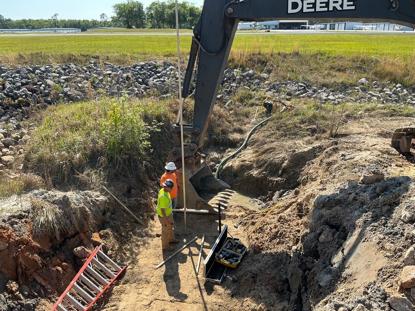 Crews replace metal storm drain pipes on West Peachtree Avenue near the Foley Airport. The city is replacing about 570 feet of lines with new concrete culvert after some aging metal pipes collapsed.