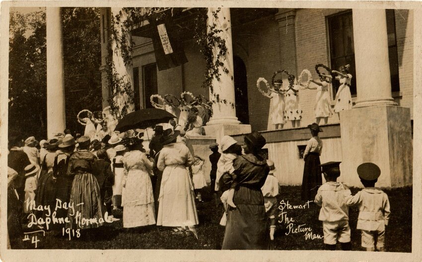 Flower girls preceded the king and queen in the coronation ceremony at Daphne May Day which included representatives of other schools.