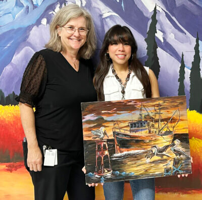 Pictured from left are Terri Smith, art teacher at Foley High School, and the 2025 Chelsea Garvin Spirit Scholarship awardee Jasmin Alvarado with her winning artwork.